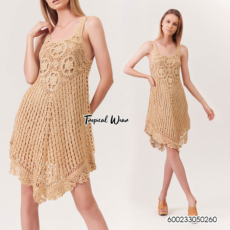 Woman in a handmade cotton crochet summer dress, free size, beige, boho style