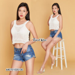 Model wearing white cotton knitted crop tank top and denim shorts in tropical style