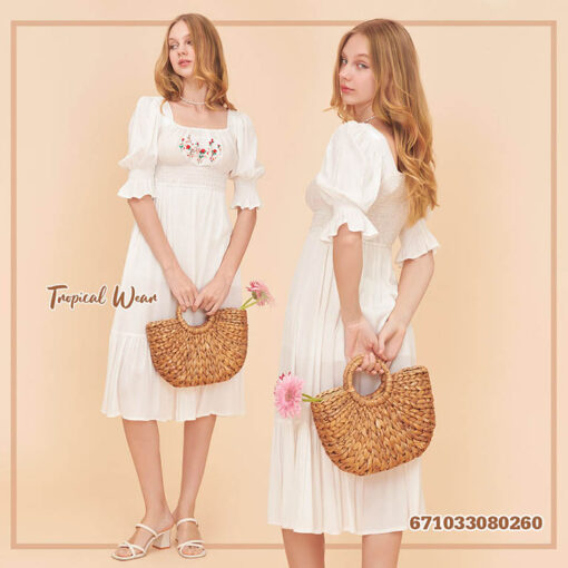 Romantic smocked prairie dress with puff sleeves and tiered skirt for a timeless, feminine look