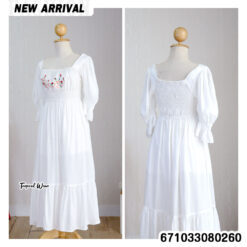 Romantic smocked prairie dress with puff sleeves and tiered skirt for a timeless, feminine look