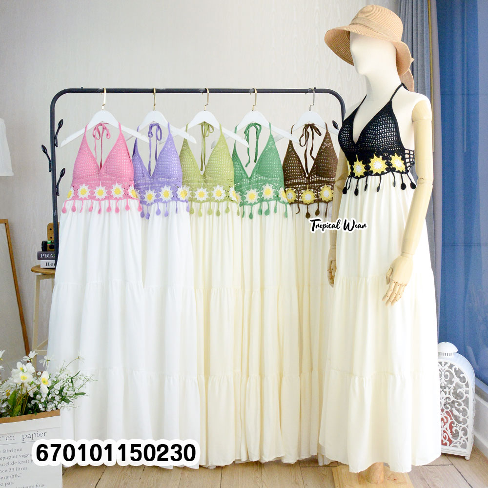 Handmade crochet bustier halter maxi dress with an adjustable back tie and flowing skirt