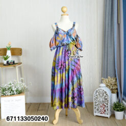 Handmade bohemian tie-dye dress on a mannequin, showcasing its flowing design.