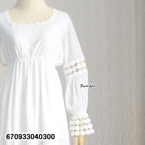 Flowy long sleeve summer dress with a relaxed fit and bohemian accents.