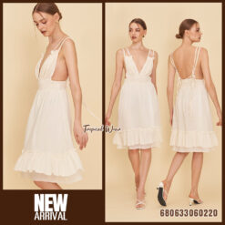 sleeveless white and cream cotton sundresses displayed with ruffle hem