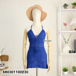 Stretch knit beachwear dress on rack and styled mannequin in indoor setting