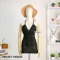 Stretch knit beachwear dress on rack and styled mannequin in indoor setting