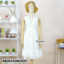 sleeveless white and cream cotton sundresses displayed with ruffle hem