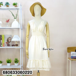 sleeveless white and cream cotton sundresses displayed with ruffle hem