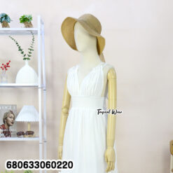 sleeveless white and cream cotton sundresses displayed with ruffle hem