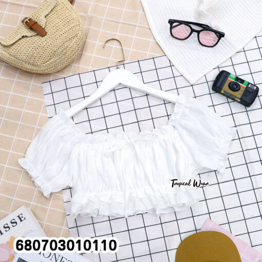 Off shoulder white cotton crop top with puff sleeves and ruffle hem – flatlay display