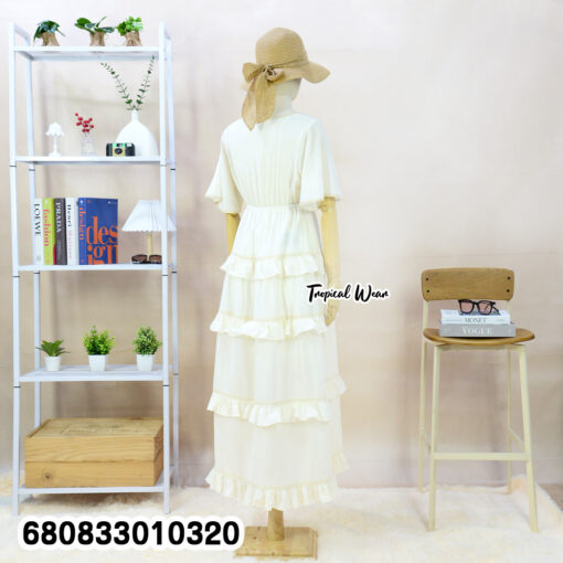 Free-size cotton tiered maxi dress with ruffle layers, V-neckline, and short flutter sleeves.