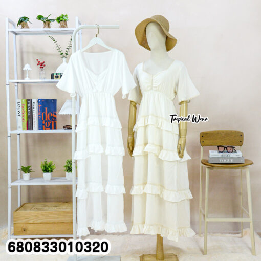 Free-size cotton tiered maxi dress with ruffle layers, V-neckline, and short flutter sleeves.