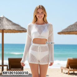 Woman wearing knit beach co-ord set with long sleeve top and pants, lightweight summer layering outfit.