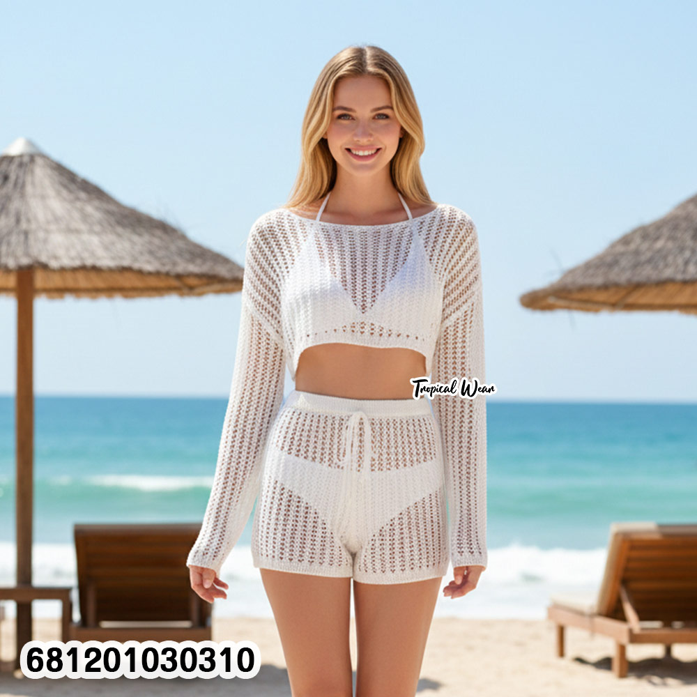 Woman wearing knit beach co-ord set with long sleeve top and pants, lightweight summer layering outfit.