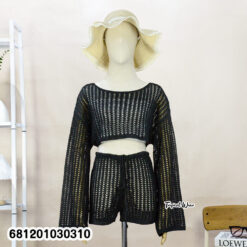 Woman wearing knit beach co-ord set with long sleeve top and pants, lightweight summer layering outfit.
