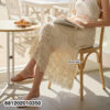 Flowing romantic lace skirt with layered details styled for summer