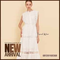 Elegant white lace maxi dress with sleeveless design and waist tie, styled for summer resort fashion.