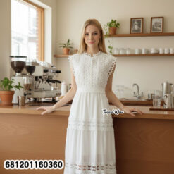 Elegant white lace maxi dress with sleeveless design and waist tie, styled for summer resort fashion.