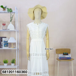 Elegant white lace maxi dress with sleeveless design and waist tie, styled for summer resort fashion.