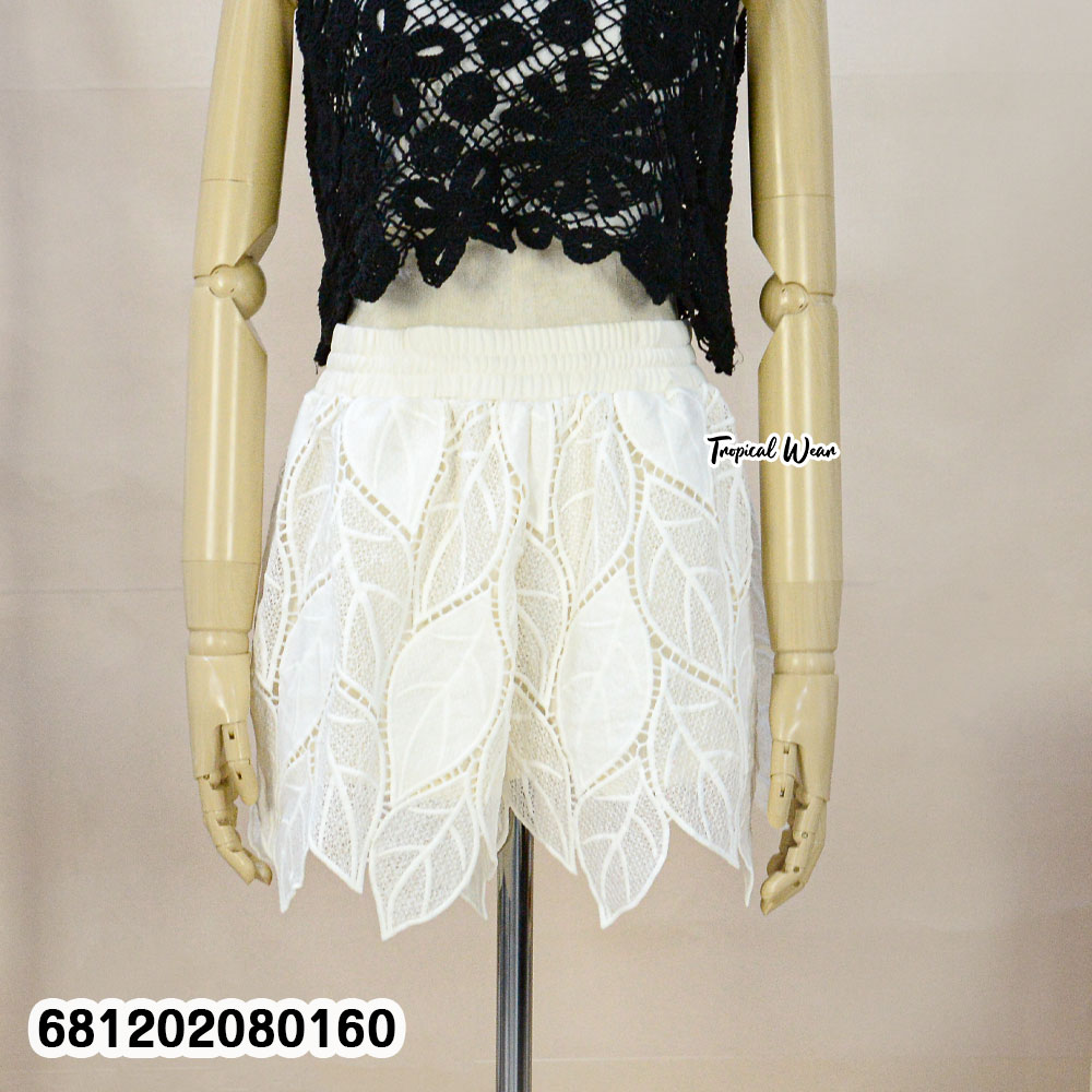 White nylon lace beach shorts styled for tropical resort look