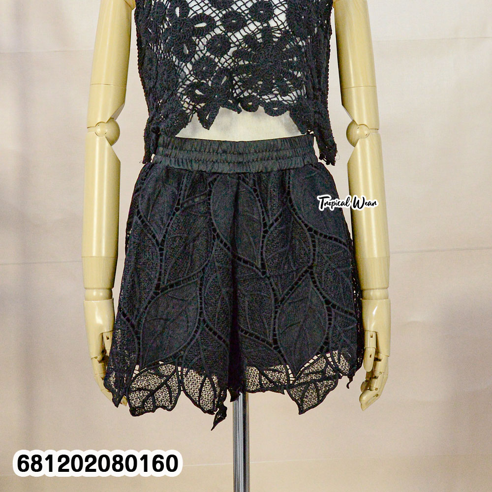 White nylon lace beach shorts styled for tropical resort look