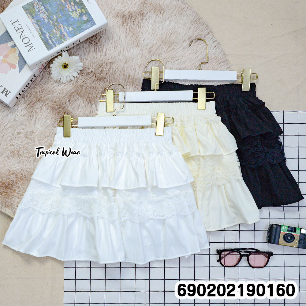 White lace tiered mini skirt free size with elastic waistband, lightweight breathable fabric, perfect for summer beachwear and casual outfits