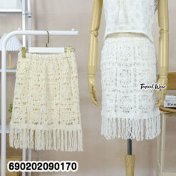 White cotton crochet fringe skirt for women with textured square knit detail and relaxed resortwear silhouette.