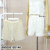 Women crochet cotton shorts in white and cream tones with breathable resort beachwear styling and textured knit pattern.